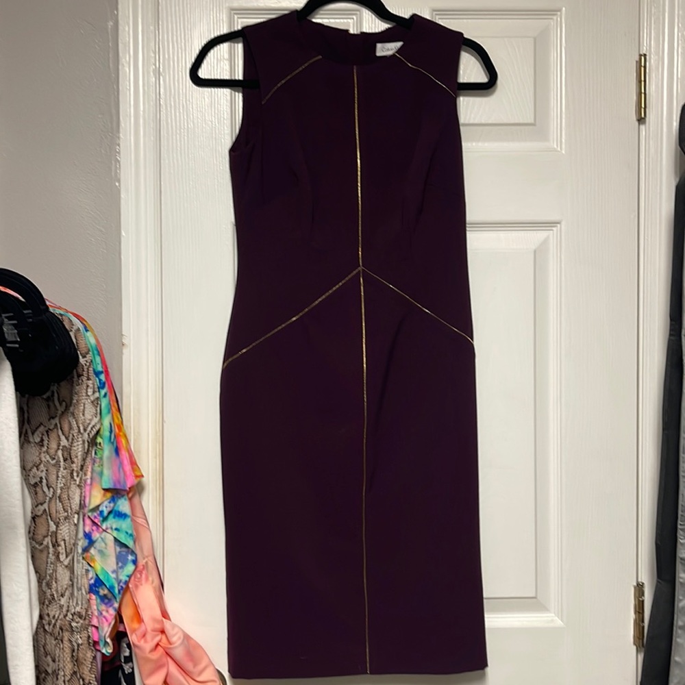 Calvin Klein dress with gold accents.